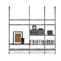 Metal Shelving Unit With Multiple Layers Holding Books Frames And Decorative Items 3d model
