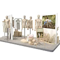 Fashion Store Display Arrangement With Multiple Mannequins Wooden Stump Bases And Clothing Racks