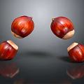 Four Shiny Brown Chestnuts Floating On Black Background With Reflections