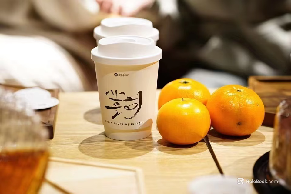 Paper Cup With White Lid Chinese Characters And Fresh Oranges On Table 3d model 