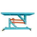 Green Tabletop Scissor Lift Table With Orange Mechanism And Wheel Base
