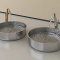 Two Modern Metal Washbasins With Gold And Silver Faucets And Running Water