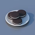 Delicious Dark Chocolate Cookies Filled With White Cream On A White Plate