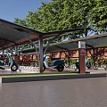 Outdoor Charging Station Facility With Covered Shelter Parked Electric Vehicles And Bicycles