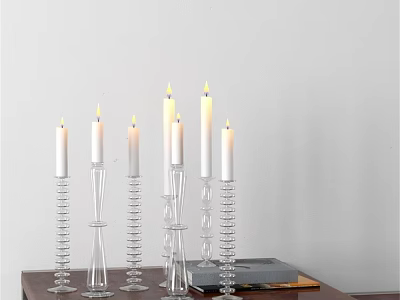 Decorative Ornament Set with Transparent Glass Candle Holders Lit White Candles on Table with Books 3d model
