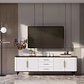 Modern White TV Stand With Gold Handles And Decorative Items On Top