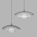 Two Modern White Pendant Lights With Transparent Textured Shades Illuminated In Interior