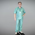 A Man In Light Green Scrub Suit With Stethoscope And ID Badge Standing Posture