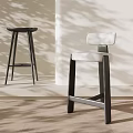 Modern Minimalist Bar Stools With Light Upholstery And Dark Legs In Bright Interior
