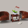 Brown Leather Armchairs And Wooden Coffee Table With Blue White Vase Pink Orchid And Magazines