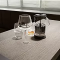 Elegant Wine Bottle and Glasses on Light Wooden Table with Candle Holder