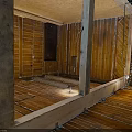 Unfinished Interior Construction With Wooden Framing Floor Joists Wall Studs And Electrical Wiring