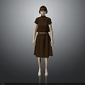 Child Wearing Brown Top And Skirt Standing Against Gray Background