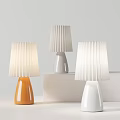 Modern Minimalist Table Lamps with Pleated Shades and Rounded Bases in Orange Gray and White