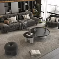 Gray Sofa With Throw Pillows Blanket Round Coffee Table Set Living Room Rug Plants Ottoman