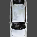 Elegant Silver Luxury Sedan With Sleek Body Design And Large Alloy Wheels