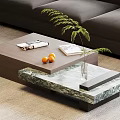 Modern Coffee Table With Wooden And Marble Top Magazine Book Oranges Green Plant Vase