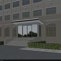 Modern Building Main Entrance With Glass Doors Covered Awning Stone Steps And Landscaped Greenery