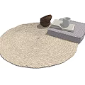 Light Beige Woven Round Rug With Open Book White Mug And Brown Basket