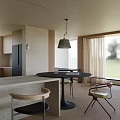 Modern Cozy Living And Dining Room With Panoramic Floor Windows And Comfortable Natural Style Furniture