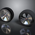 Two Black Tires With Silver Rims And Tread Patterns On Dark Background 3d model