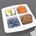 White Divided Plate With Hard Boiled Eggs Apricots Blueberries And Chocolate Chip Cookies