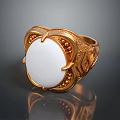 Luxurious Gold Ring With White Circular Stone And Ornate Gold Decorations