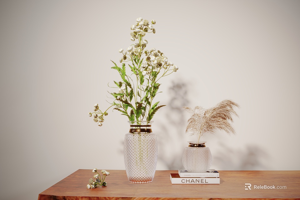 Transparent Vase With White Flowers Green Leaves And Smaller Vase Dried Grass On Wooden Table CHANEL Book Light Background 3d model 
