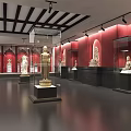 Cultural Center Exhibition Hall With Red Walls Wooden Ceiling And Glass Cases Displaying Statues