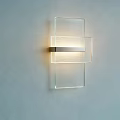 Modern Clear Glass Wall Light With Metallic Accent And Soft Illumination