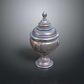 Silver Decorative Urn With Intricate Carvings Ornate Lid And Pedestal Base