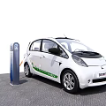 White Electric Car Parked at Charging Station for Eco Friendly Driving