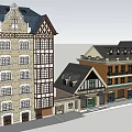Traditional Commercial Street With Brick Facade And Tudor Style Roofs And Storefronts