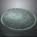 Green Oval Architectural Decorative Element With Intricate Carvings And Glossy Surface
