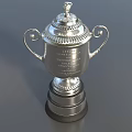 Silver Decorative Two Handled Award Trophy With Top Ornament And Engraved Base On Gray Surface 3d model