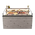 Retail Display Shelves With Glass Front Showcasing Various Cheeses And Baked Goods