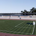 Football Field Design With Running Track Spectator Stands And Green Turf