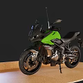 Green Sleek Modern Motorcycle With Black Accents On Wooden Display Floor