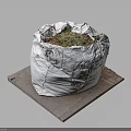 Plant Wrapped In White Bag Placed On Square Stone Slab