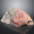 Natural Wood Stone With Rustic Textured Surface And Earthy Red Green Gray Tones