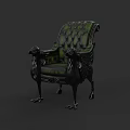 Green Tufted Armchair With Black Armrests And Ornate Claw Feet Design