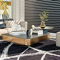 Light Colored Sofa And Coffee Table Set With Gold Base Glass Top And Decor