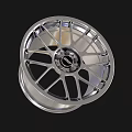 Shiny Silver Automotive Tire Rim With Modern Spoke Design And Center Logo