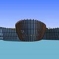 Modern Glass Building With Waterfront Reflection And Mountain Background At Dusk