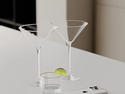 Elegant Decorative Accessories Set With Martini Glasses Lime Wedge And Mobile Phone On White Table 3d model