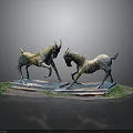 Two Antelope Sculptures In Fighting Stance With Grass Covered Base On Reflective Surface