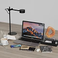 Modern Workspace Desk Setup With Laptop Desk Lamp Coffee Cup Donut Notebook Mouse And Glasses