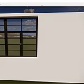 White Building Exterior With Large Glass Window And Blue Sky Cloud View