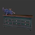 Vintage Blue Storage Cabinet With Wooden Top Multiple Drawers And Decorative Figurine