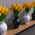 Vibrant Yellow Tulips Arranged in White and Black Vases on Wooden Shelf